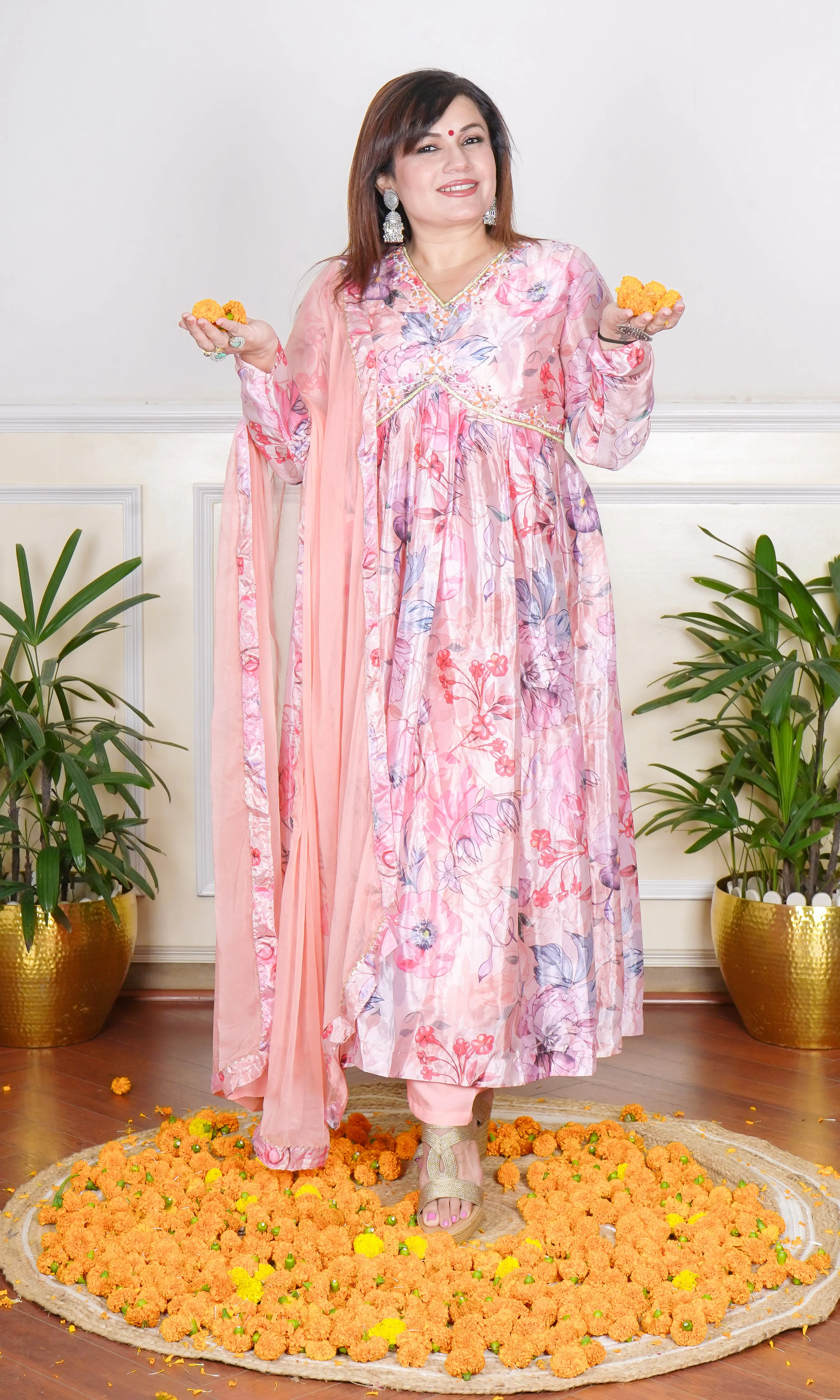 PEACH FLORAL PRINTED SEQUIN, THREAD AND CUTDANA EMBROIDERED NECKLINE FLARED KURTA WITH PANTS AND DUPATTA.